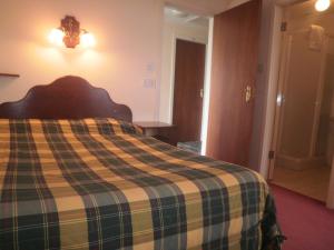 Postel nebo postele na pokoji v ubytování Sancta Maria Hotel