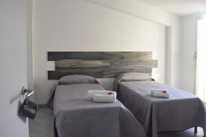 Ένα ή περισσότερα κρεβάτια σε δωμάτιο στο Ionio Sea Apartment