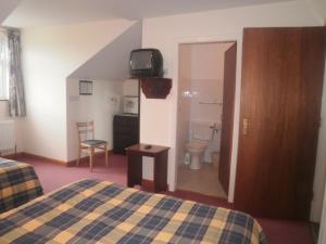 Postel nebo postele na pokoji v ubytování Sancta Maria Hotel