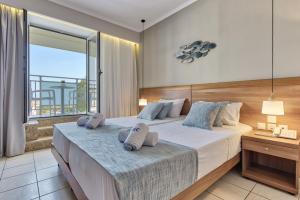 Katil atau katil-katil dalam bilik di Contessa Hotel