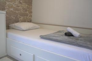 Posteľ alebo postele v izbe v ubytovaní Apartmani Mustaća dvori