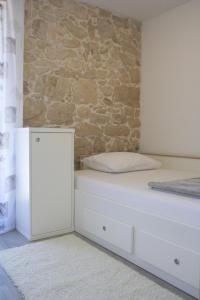 Posteľ alebo postele v izbe v ubytovaní Apartmani Mustaća dvori