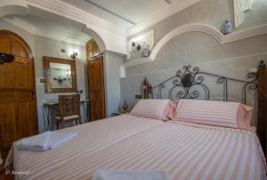 Postel nebo postele na pokoji v ubytování Casa Elias