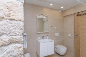 Kúpeľňa v ubytovaní Apartmani Mustaća dvori