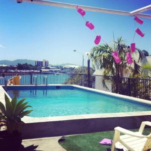 a swimming pool on the roof of a building at Adventurers Backpackers in Townsville