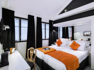 מיטה או מיטות בחדר ב-Best Western Premier Faubourg 88