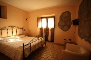 เตียงในห้องที่ Agriturismo Nociquerceto