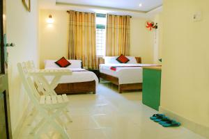 Ένα ή περισσότερα κρεβάτια σε δωμάτιο στο Champa Hue Hotel