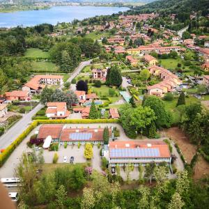 an aerial view of a town with houses and trees at Green Hotel in Vergiate