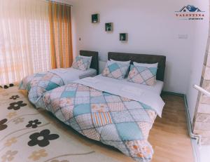 a bedroom with two twin beds in a room at Valentina Apartments in Gevgelija