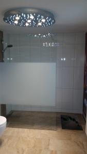 a white room with a toilet and a ceiling at Ferienwohnung Hirmer in Zirndorf +30 photos