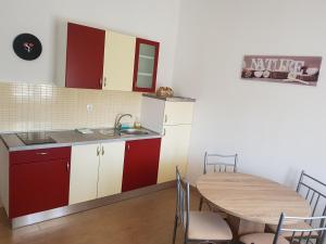 a kitchen and dining room with a table and a sink at Camp Krka in Lozovac