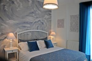 מיטה או מיטות בחדר ב-Thalìa Guest House Marzamemi