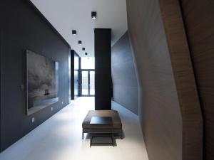 a hallway with a bench in the middle of a room at The Met Hotel Thessaloniki, a Member of Design Hotels in Thessaloniki