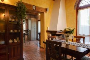 a kitchen with a table and a dining room at La Vecchia Stazione Ravenna in Ravenna