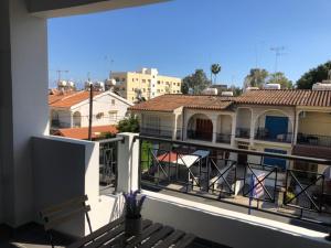 a balcony with a view of a city at Must Stay - City Center in Larnaca