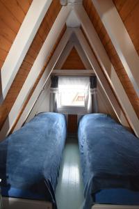 Un pat sau paturi într-o cameră la Ferienhaus Giebelei