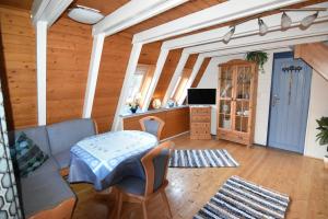 a living room with a couch and a table at Ferienhaus Giebelei in Medebach