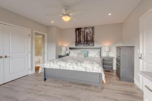 a bedroom with a bed and a ceiling fan at Adela's Bed and Breakfast in West Kelowna