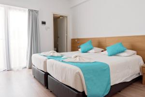 Voodi või voodid majutusasutuse Pyramos Hotel toas