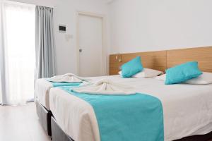 Voodi või voodid majutusasutuse Pyramos Hotel toas