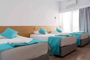 Postel nebo postele na pokoji v ubytování Pyramos Hotel + 37 fotografií