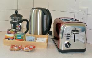 a toaster sitting on a counter next to a coffee maker at Oxford Village Motels in Oxford