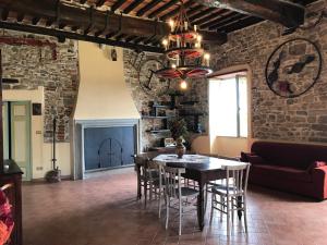 a dining room with a table and chairs at La Calona in Camaiore
