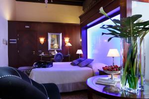 Una cama o camas en una habitación de Hotel Liassidi Palace