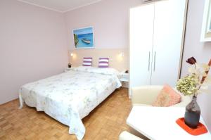 Postel nebo postele na pokoji v ubytování Apartments Ederina
