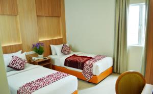 Tempat tidur dalam kamar di Prime Hotel at TRX Tower