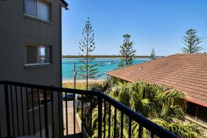 a view of the beach from a balcony of a house at Bayview Beach Holiday Apartments in Gold Coast