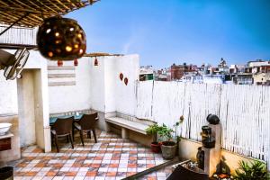 A balcony or terrace at Smyle Inn - Best Value Hotel near New Delhi Station