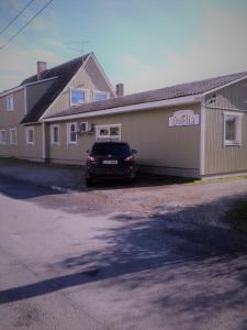 a car parked in front of a building at Ovelia B&B in Kuressaare