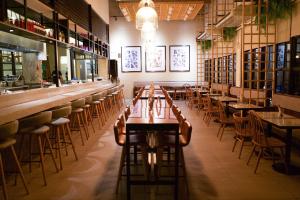 a row of tables and chairs in a restaurant at Lub d Philippines Makati in Manila