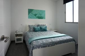 A bed or beds in a room at Apartamento Conpe
