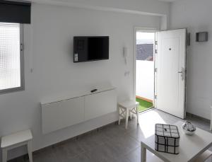 A television and/or entertainment centre at Apartamento Conpe