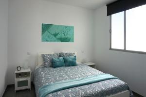 A bed or beds in a room at Apartamento Conpe