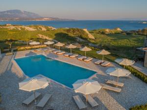 an overhead view of a pool with chairs and umbrellas at Tramonto Suites in Xi