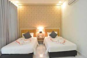 Sangkahak Mith Hotel客房内的一张或多张床位