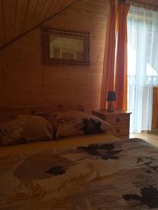 Posteľ alebo postele v izbe v ubytovaní Domki Komfort