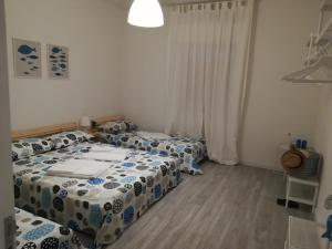Posteľ alebo postele v izbe v ubytovaní Case degli Avi, camere nel Borgo marinaro