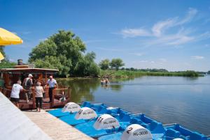 a group of people on a boat on the water at Seehotel Brandenburg an der Havel in Brielow