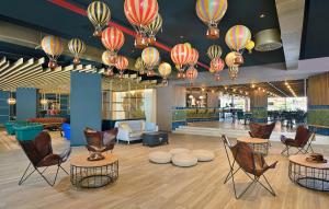 a lobby with chairs and colorful chinese lights at Sol Katmandu Park & Resort in Magaluf