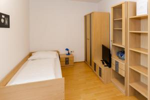 Łóżko lub łóżka w pokoju w obiekcie Appartement Graz - Ihr erstklassiges Zuhause fernab von Zuhause