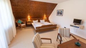 מיטה או מיטות בחדר ב-Gasthaus zum Hirsch