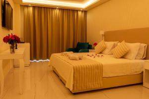 Un ou plusieurs lits dans un hébergement de l'établissement Ibiscus Corfu Hotel