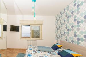 Posteľ alebo postele v izbe v ubytovaní Sunset Holiday Home Taormina