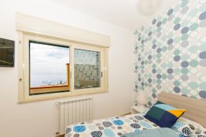Posteľ alebo postele v izbe v ubytovaní Sunset Holiday Home Taormina