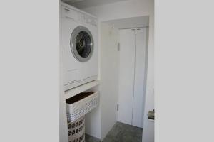 a white washer and dryer in a white room at Rural Place WIFI Family Finca SAT in Sant Francesc Xavier